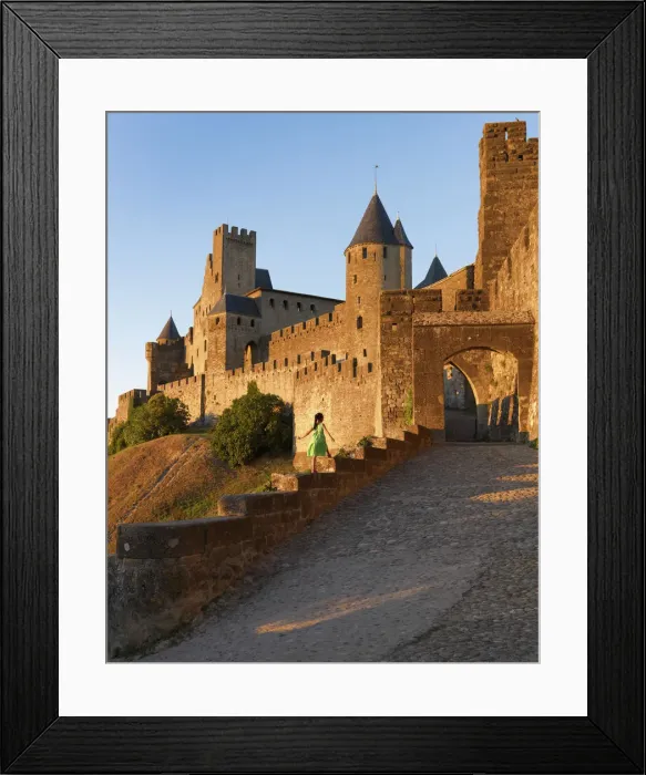 Framed Print : France, Languedoc, Carcassonne, girl walking on wall to Aude gate (MR) Framed Print : France, Languedoc, Carcassonne, girl walking on wall to Aude gate (MR)