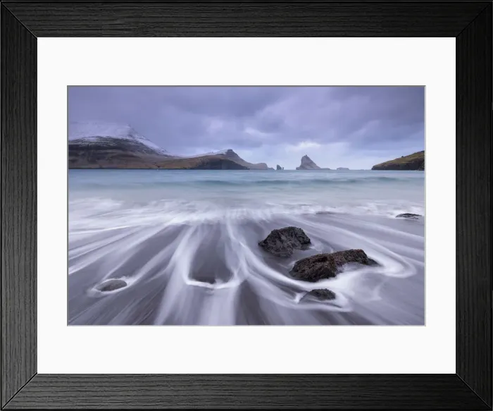 Framed Print : Waves crash onto the black sandy beach at Bour on the island of Vagar in the Faroe Islands, Denmark, Europe. Winter (March) 2015 Framed Print : Waves crash onto the black sandy beach at Bour on the island of Vagar in the Faroe Islands, Denmark, Europe. Winter (March) 2015