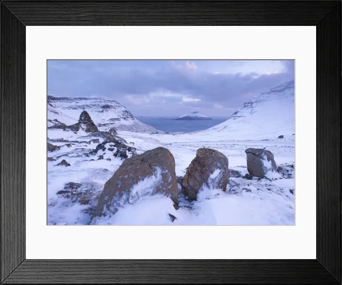 Framed Print : Snow covered Streymoy mountain landscape looking towards the island of Koltur, Faroe Framed Print : Snow covered Streymoy mountain landscape looking towards the island of Koltur, Faroe