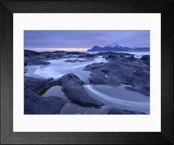 Framed Print : Atlantic waves surge over the black basalt ledges at Gjogv on the island of Eysturoy Framed Print : Atlantic waves surge over the black basalt ledges at Gjogv on the island of Eysturoy