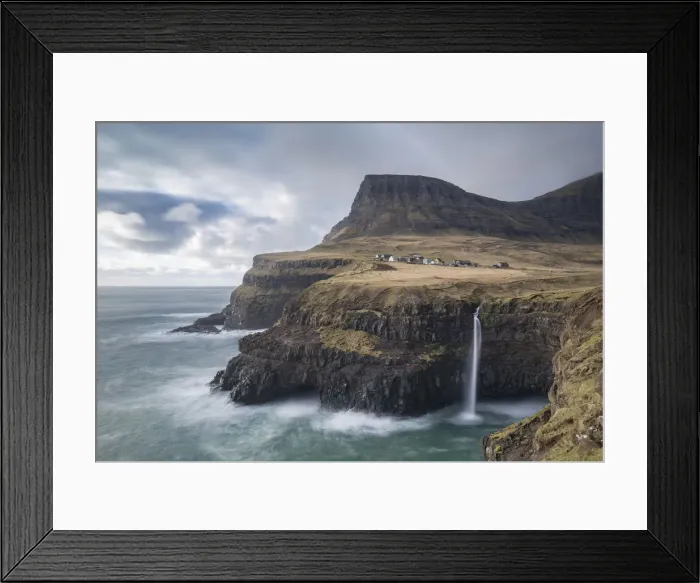 Framed Print : Dramatic coastal scenery near the village of Gsadalur on the island of Vaagar in Framed Print : Dramatic coastal scenery near the village of Gsadalur on the island of Vaagar in