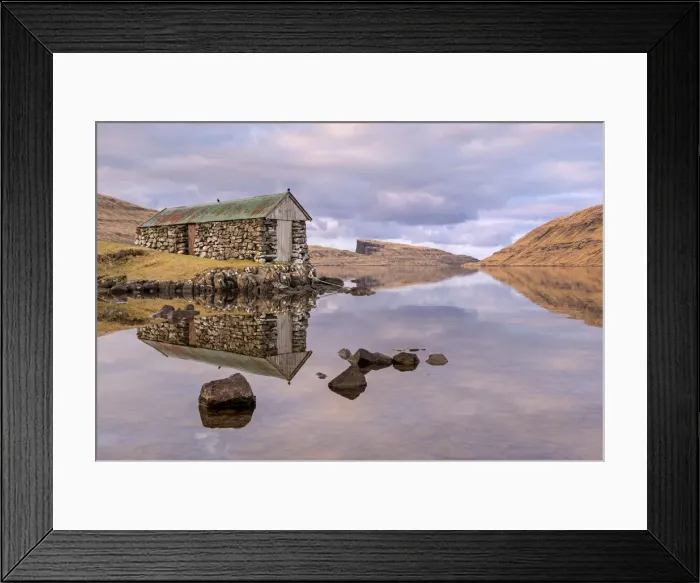 Framed Print : Stone boathouse on Sorvagsvatn / Leitisvatn Lake on the island of Framed Print : Stone boathouse on Sorvagsvatn / Leitisvatn Lake on the island of