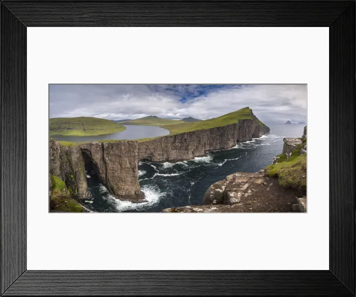 Framed Print : Towering sea cliffs on the island of Vagar in the Faroe Islands, Denmark. Summer Framed Print : Towering sea cliffs on the island of Vagar in the Faroe Islands, Denmark. Summer