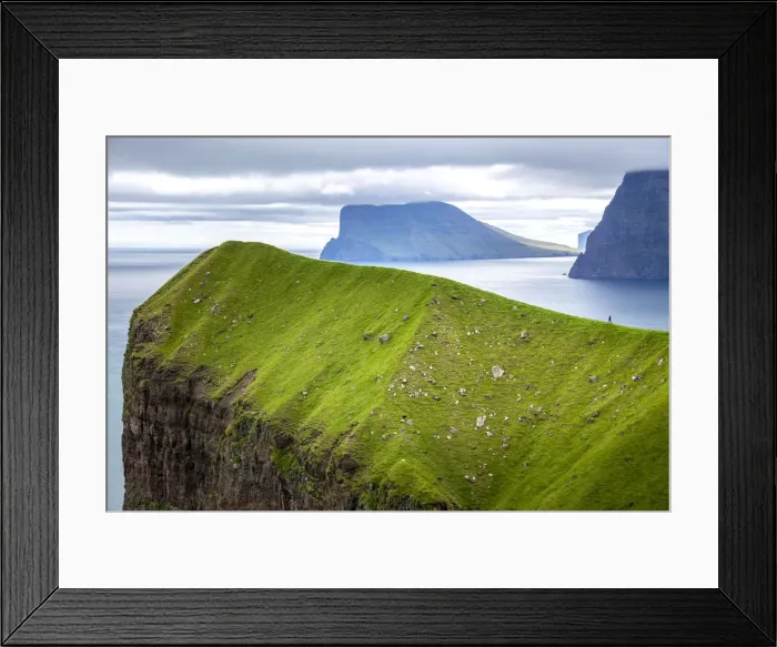 Framed Print : Hiker over a cliff in Kalsoy, Faroe Islands, Europe Framed Print : Hiker over a cliff in Kalsoy, Faroe Islands, Europe