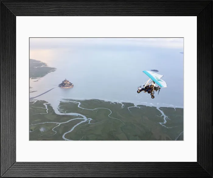 Framed Print : aerial view of Mont Saint Michel and Ultra light aircraft at high tide, Manche, France Framed Print : aerial view of Mont Saint Michel and Ultra light aircraft at high tide, Manche, France