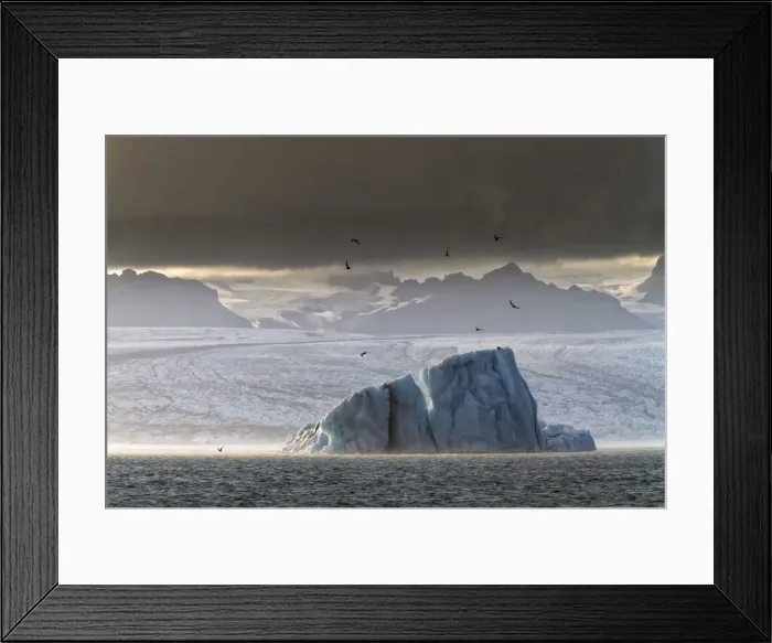 Framed Print : Iceland, South Iceland, A monumental iceberg in the Jokulsarlon Lagoon at dusk Framed Print : Iceland, South Iceland, A monumental iceberg in the Jokulsarlon Lagoon at dusk