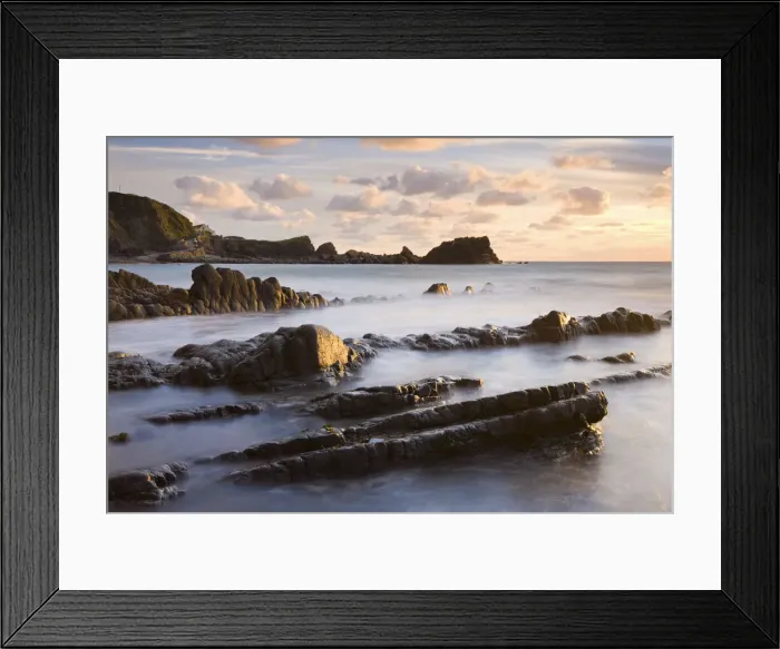 Framed Print : Late evening sunshine glistens on the wet rocks at Hartland Quay, North Devon, England Framed Print : Late evening sunshine glistens on the wet rocks at Hartland Quay, North Devon, England