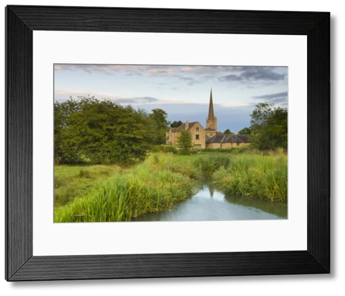 Framed Print : Burford Mill and Church viewed from the River Windrush in the water meadows, Burford