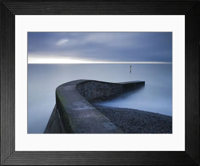 Framed Print : Stone jetty on the seafront at Sidmouth, Devon, England. Winter Framed Print : Stone jetty on the seafront at Sidmouth, Devon, England. Winter