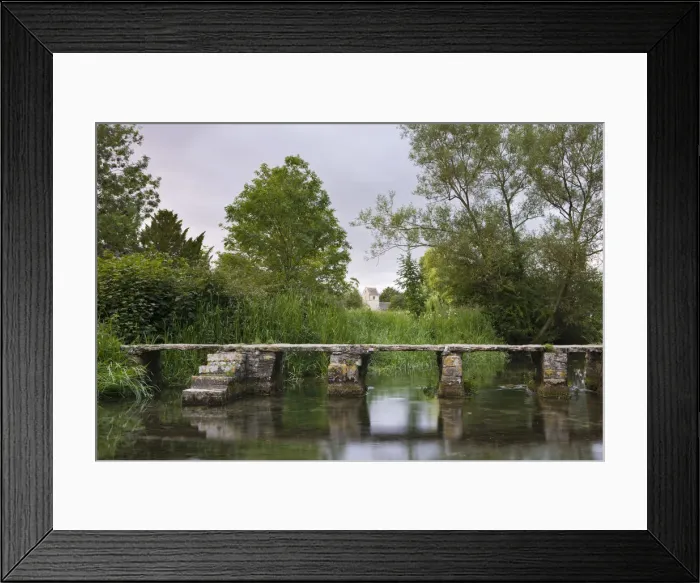 Framed Print : Looking towards Eastleach Turville Church from the stone clapper bridge crossing Framed Print : Looking towards Eastleach Turville Church from the stone clapper bridge crossing