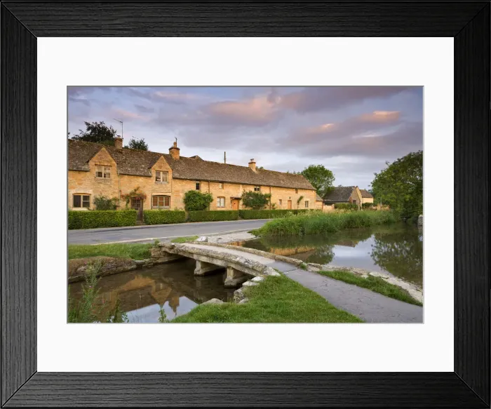 Framed Print : Cottages and stone footbridge in the Cotswolds village of Lower Slaughter, Gloucestershire Framed Print : Cottages and stone footbridge in the Cotswolds village of Lower Slaughter, Gloucestershire