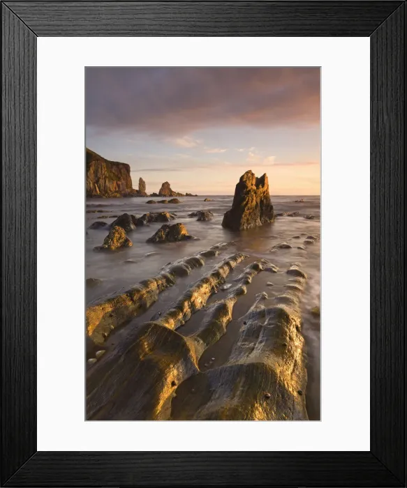 Framed Print : Golden evening sunlight bathes the rocks and ledges at Bantham in the South Hams, Devon Framed Print : Golden evening sunlight bathes the rocks and ledges at Bantham in the South Hams, Devon