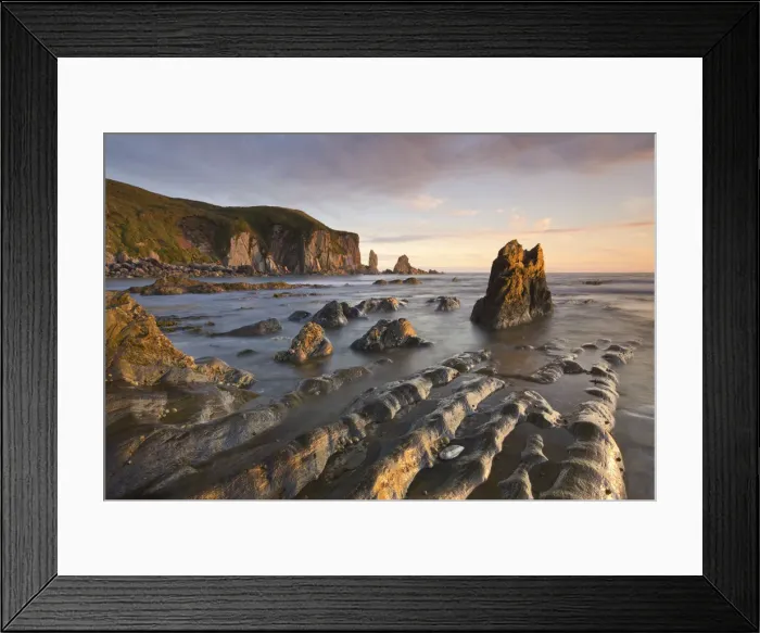 Framed Print : Golden evening sunlight bathes the rocks and ledges at Bantham in the South Hams Framed Print : Golden evening sunlight bathes the rocks and ledges at Bantham in the South Hams