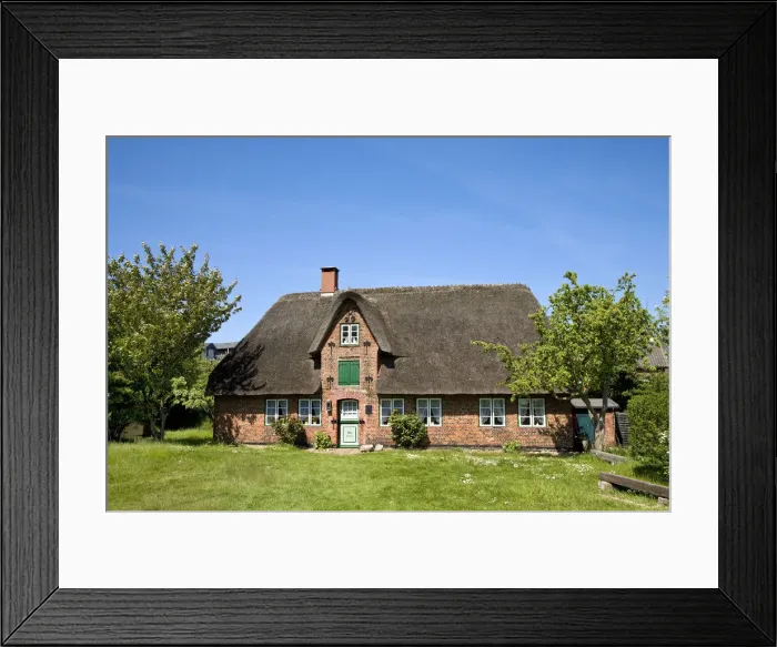 Framed Print : Thatched roof house, former captains house Oomrang Hus, Nebel, Amrum Island, North Framed Print : Thatched roof house, former captains house Oomrang Hus, Nebel, Amrum Island, North