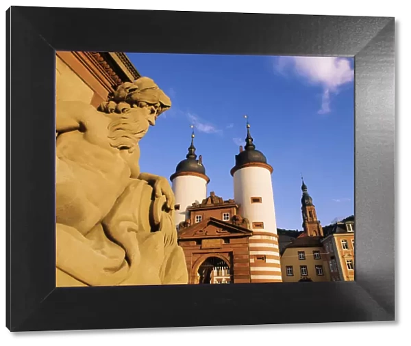 Germany, Bavaria, Heidelberg, Statue on bridge and Heidelberg gate