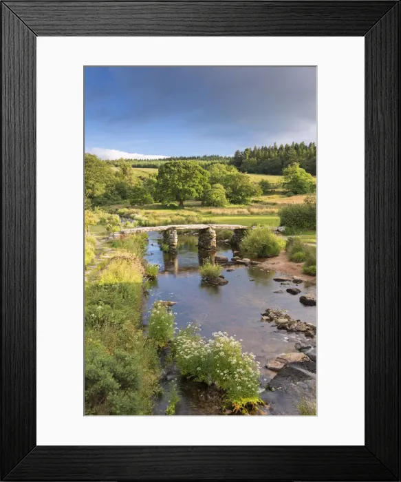 Framed Print : Ancient clapper bridge at Postbridge, Dartmoor National Park, Devon, England. Summer Framed Print : Ancient clapper bridge at Postbridge, Dartmoor National Park, Devon, England. Summer