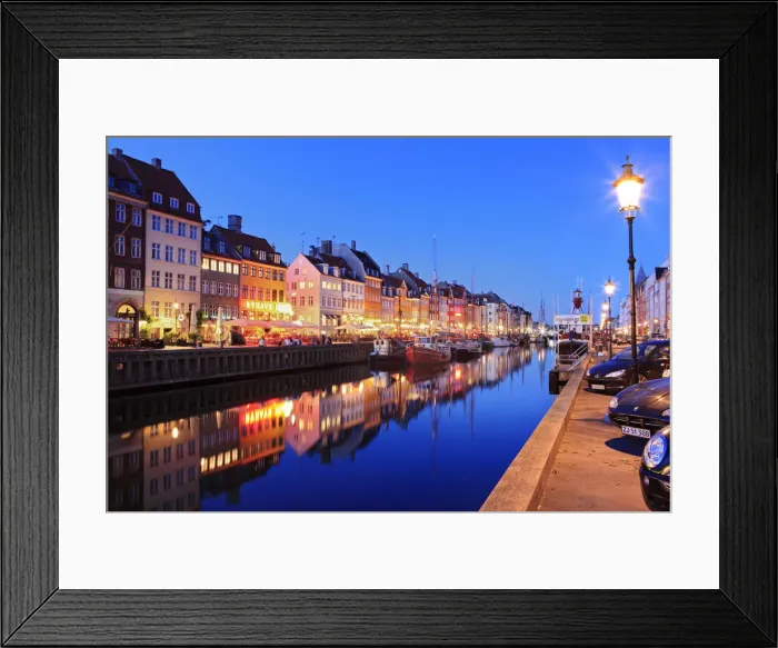 Framed Print : Europe, Denmark, Zealand, Copenhagen, a night time shot of colourful houses in Nyhavn