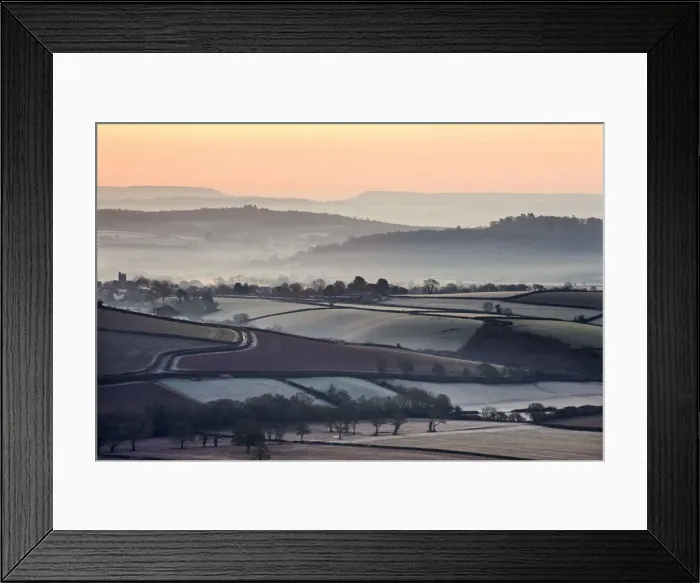 Framed Print : Overlooking frost and mist covered countryside at dawn near the village of Silverton Framed Print : Overlooking frost and mist covered countryside at dawn near the village of Silverton