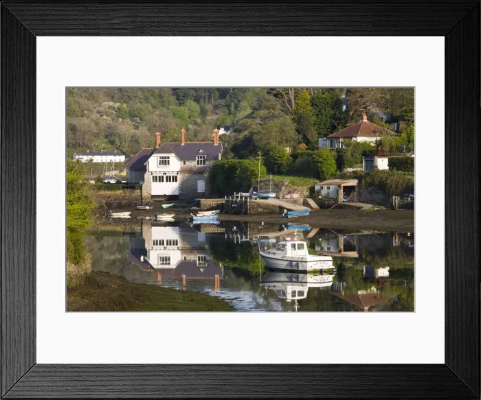 Framed Print : Boats and houses beside the River Yealm in the picturesque South Hams village of Newton Framed Print : Boats and houses beside the River Yealm in the picturesque South Hams village of Newton