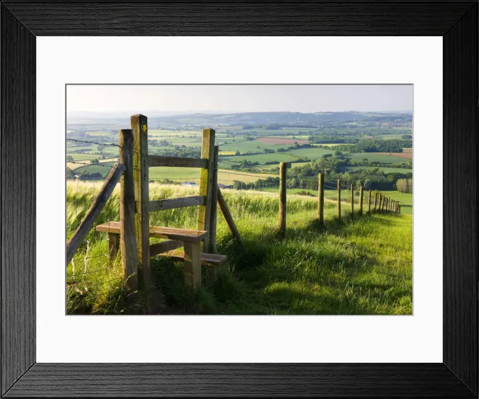 Framed Print : Footpath and style leading over fence through fields, Raddon Hill, Mid Devon, England Framed Print : Footpath and style leading over fence through fields, Raddon Hill, Mid Devon, England