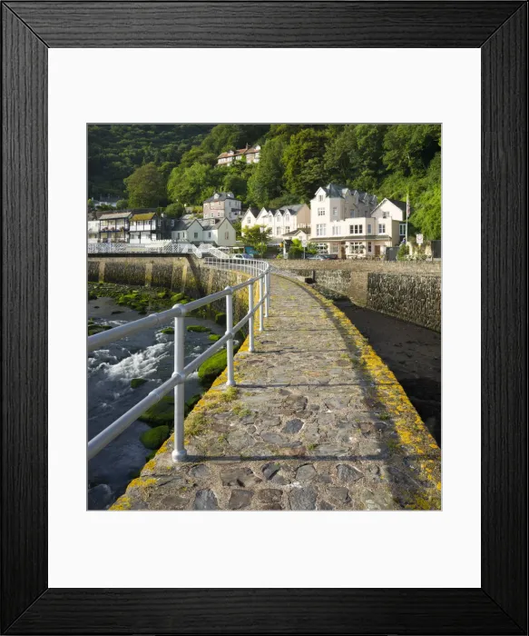 Framed Print : Stone harbour wall and village of Lynmouth on a summer morning, Exmoor National Park Framed Print : Stone harbour wall and village of Lynmouth on a summer morning, Exmoor National Park