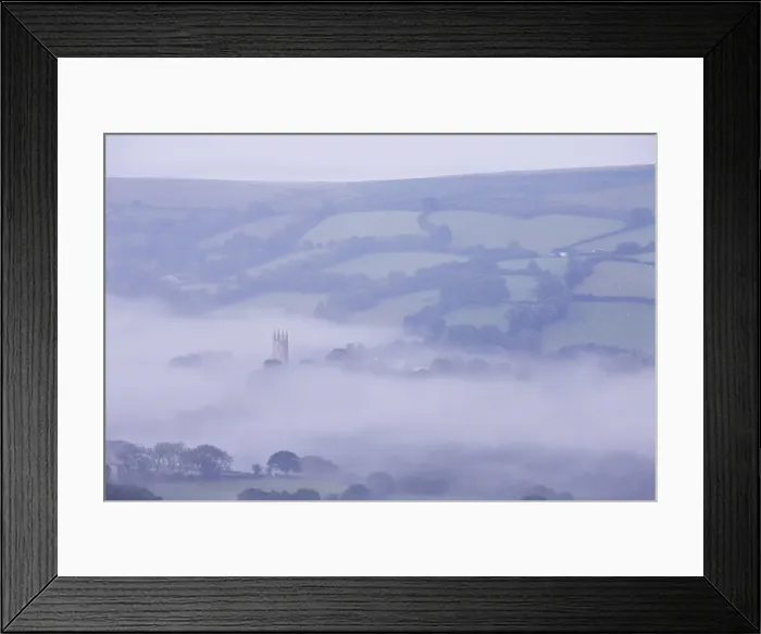 Framed Print : Morning mist swirls around the church tower of Widecombe in the Moor, Dartmoor, Devon Framed Print : Morning mist swirls around the church tower of Widecombe in the Moor, Dartmoor, Devon
