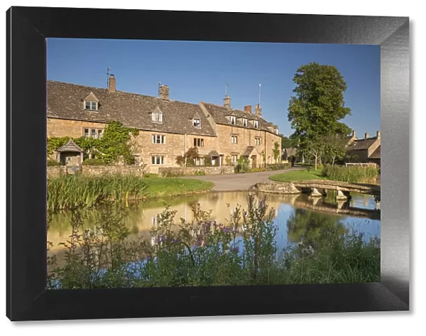 Cottages beside the River Eye in the picturesque Cotswold village of Lower Slaughter