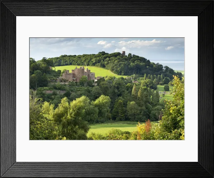 Framed Print : Dunster Castle and Conygar Tower in Exmoor National Park, Somerset, England. Summer Framed Print : Dunster Castle and Conygar Tower in Exmoor National Park, Somerset, England. Summer