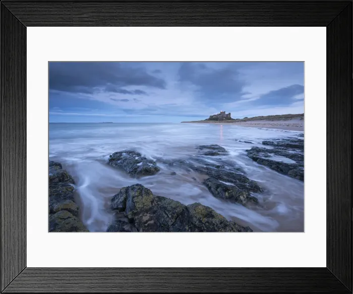 Framed Print : Stormy evening on the beach near Bamburgh Castle, Northumberland, England. Winter Framed Print : Stormy evening on the beach near Bamburgh Castle, Northumberland, England. Winter