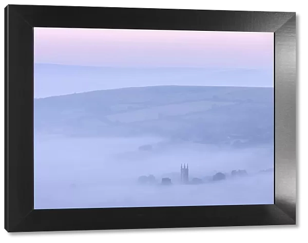 Widecombe in the Moor shrouded in morning mist, Dartmoor, Devon, England