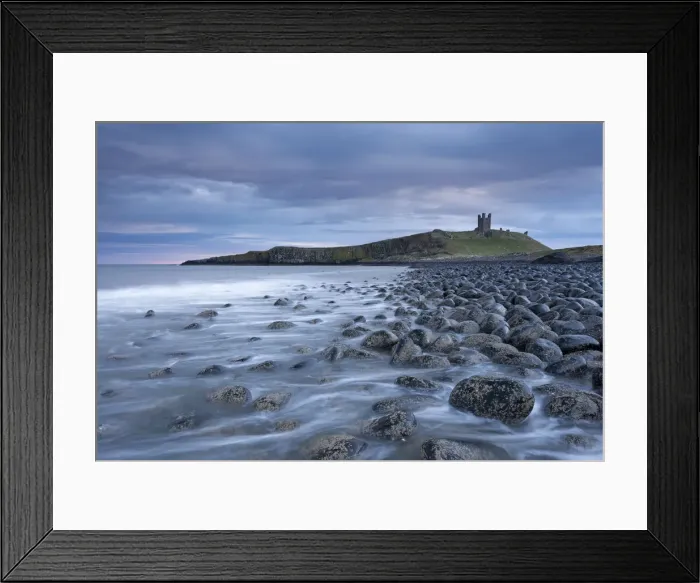 Framed Print : Dunstanburgh Castle above the boulder covered Embleton Bay, Northumberland, England Framed Print : Dunstanburgh Castle above the boulder covered Embleton Bay, Northumberland, England