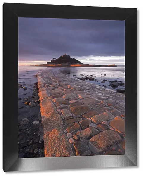 First light of day on the stone causeway leading to St Michaels Mount, Marazion, Cornwall