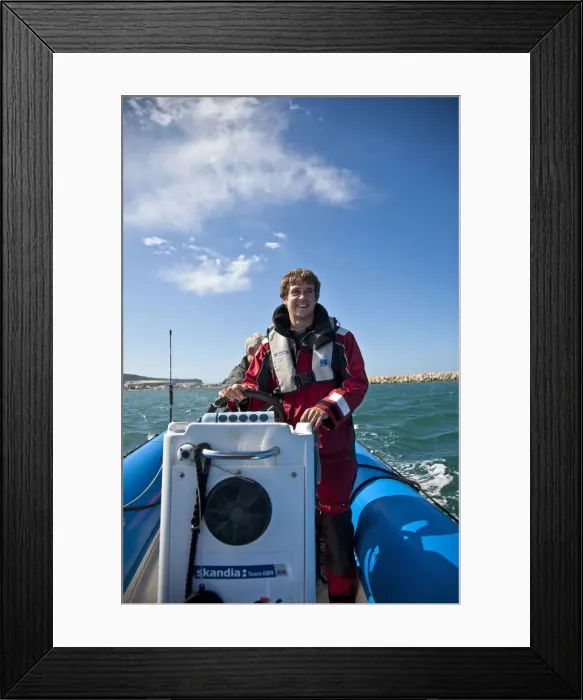 Framed Print : Dorset, England. Sailing coach Ian Martin prepares a course for the GBR 29ers sailing Framed Print : Dorset, England. Sailing coach Ian Martin prepares a course for the GBR 29ers sailing