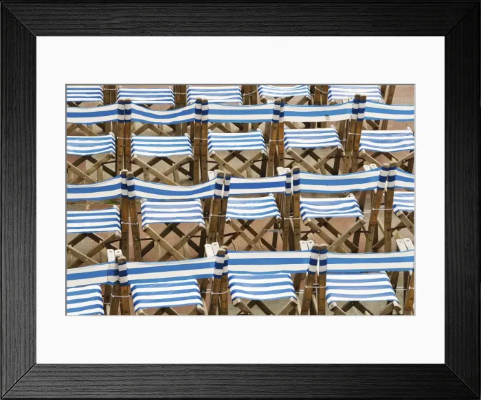 Framed Print : Rows of traditional blue and white deckchairs, Eastbourne, Sussex, UK Framed Print : Rows of traditional blue and white deckchairs, Eastbourne, Sussex, UK