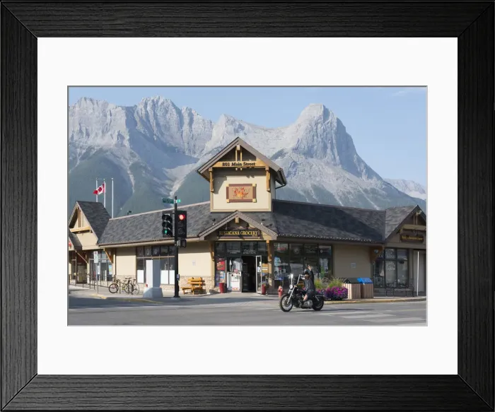 Framed Print : Canada, Alberta, Canmore, biker on main street Framed Print : Canada, Alberta, Canmore, biker on main street