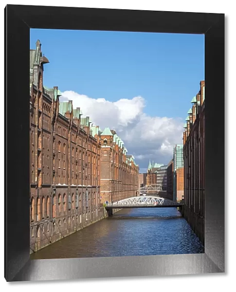 Germany, Hamburg. Historic warehouse buildings along the Brooksfleet canal, in the