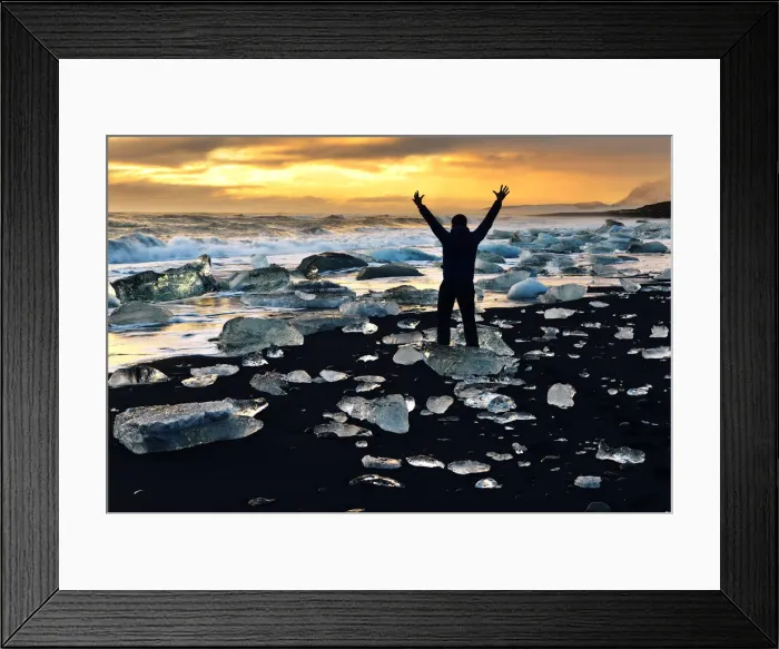 Framed Print : Man stands amongst the icebergs, Glacial lake with icebergs Jokulsarlon, Iceland Framed Print : Man stands amongst the icebergs, Glacial lake with icebergs Jokulsarlon, Iceland