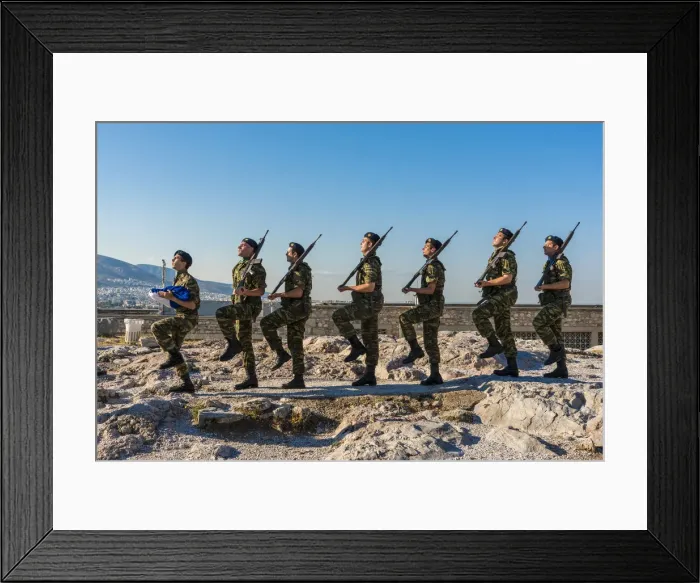Framed Print : Greek army soldiers perform a ceremonial march on the Acropolis before raising Framed Print : Greek army soldiers perform a ceremonial march on the Acropolis before raising
