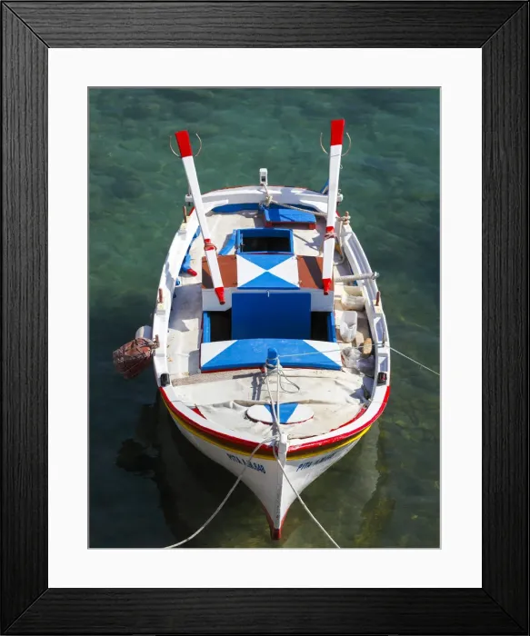 Framed Print : Colourful traditional fishingboat in the small village of Mandraki on the island of Milos Framed Print : Colourful traditional fishingboat in the small village of Mandraki on the island of Milos