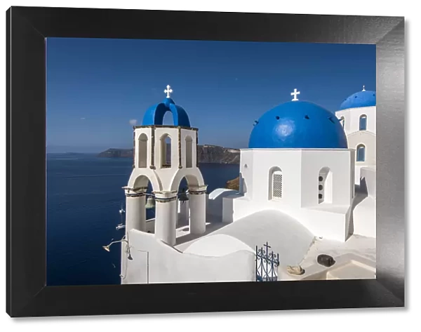 Greek orthodox church with blue domes in Oia, Santorini, South Aegean, Greece