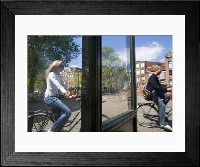 Framed Print : Riding a bike, Amsterdam, the Netherlands Framed Print : Riding a bike, Amsterdam, the Netherlands