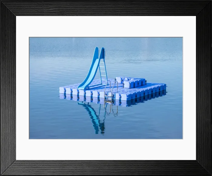 Framed Print : Blue dock with water slide floating in blue lake, Hamburg Stadtpark, Hamburg, Germany Framed Print : Blue dock with water slide floating in blue lake, Hamburg Stadtpark, Hamburg, Germany