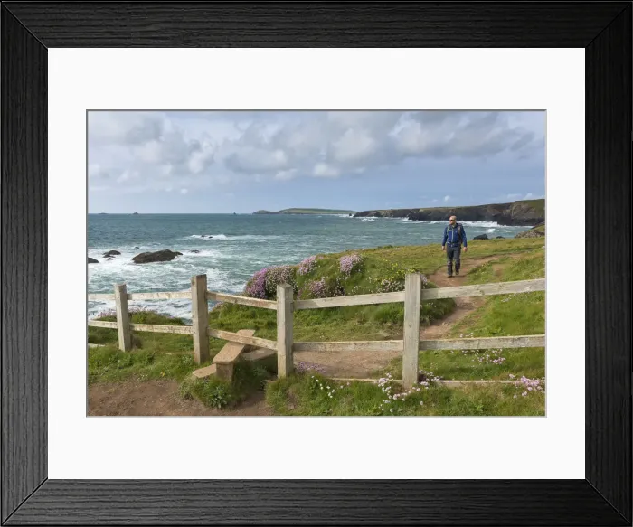 Framed Print : Man walking the South West Coast Path near Trevose Head, Cornwall, England. Spring Framed Print : Man walking the South West Coast Path near Trevose Head, Cornwall, England. Spring