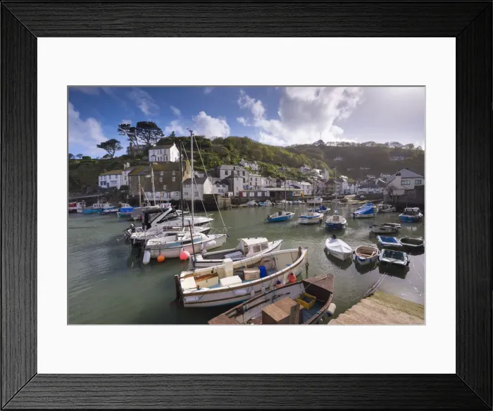 Framed Print : Fishing boats moored in picturesque Polperro harbour on a sunny Spring evening, Cornwall