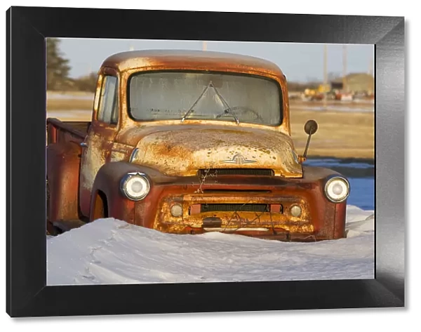 Saskatchewan, Canada. An old truck rusting in a farmers field