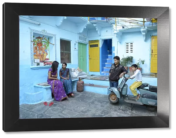 Group of young people relaxing in a courtyard in Udaipur, Rajasthan, India, Asia MR
