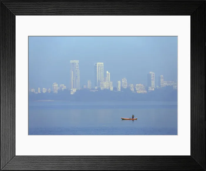 Framed Print : India, Maharashtra, Mumbai, a fisherman in a traditional boat fishing off Nariman Point Framed Print : India, Maharashtra, Mumbai, a fisherman in a traditional boat fishing off Nariman Point
