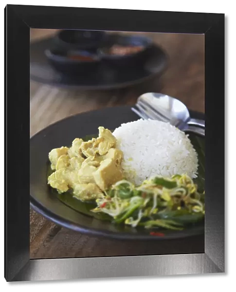 Balinese dish of Be Siap Basa Mekalas (chicken in cardamon sauce), Bali, Indonesia