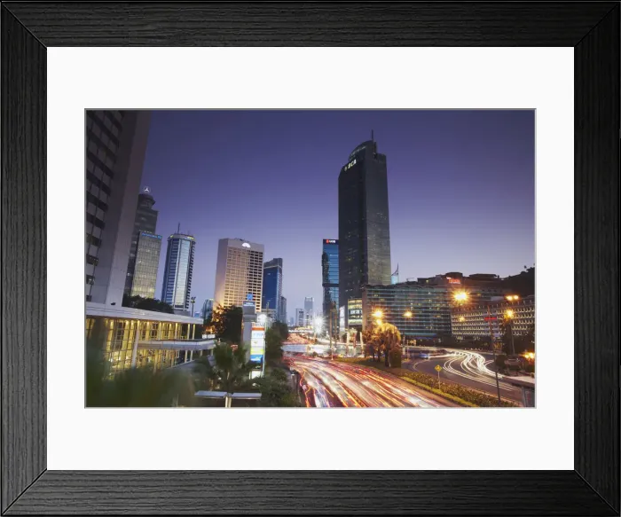 Framed Print : Traffic moving along Jalan Thamsin at dusk, Jakarta, Java, Indonesia Framed Print : Traffic moving along Jalan Thamsin at dusk, Jakarta, Java, Indonesia