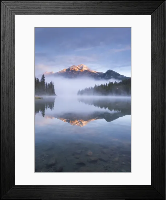 Framed Print : Pyramid Mountain in the Canadian Rockies surrounded by mist and reflected in Pyramid Lake